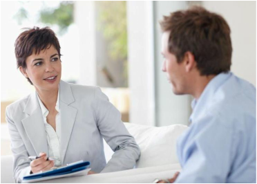 Female counsellor interviewing a man.