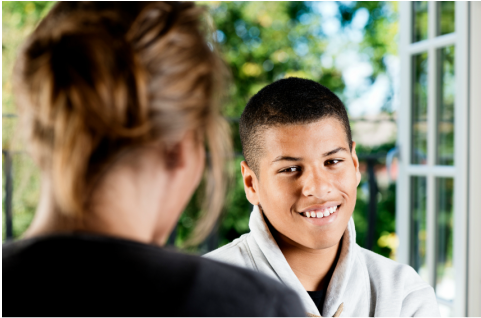 Adolescent talking to a counsellor.